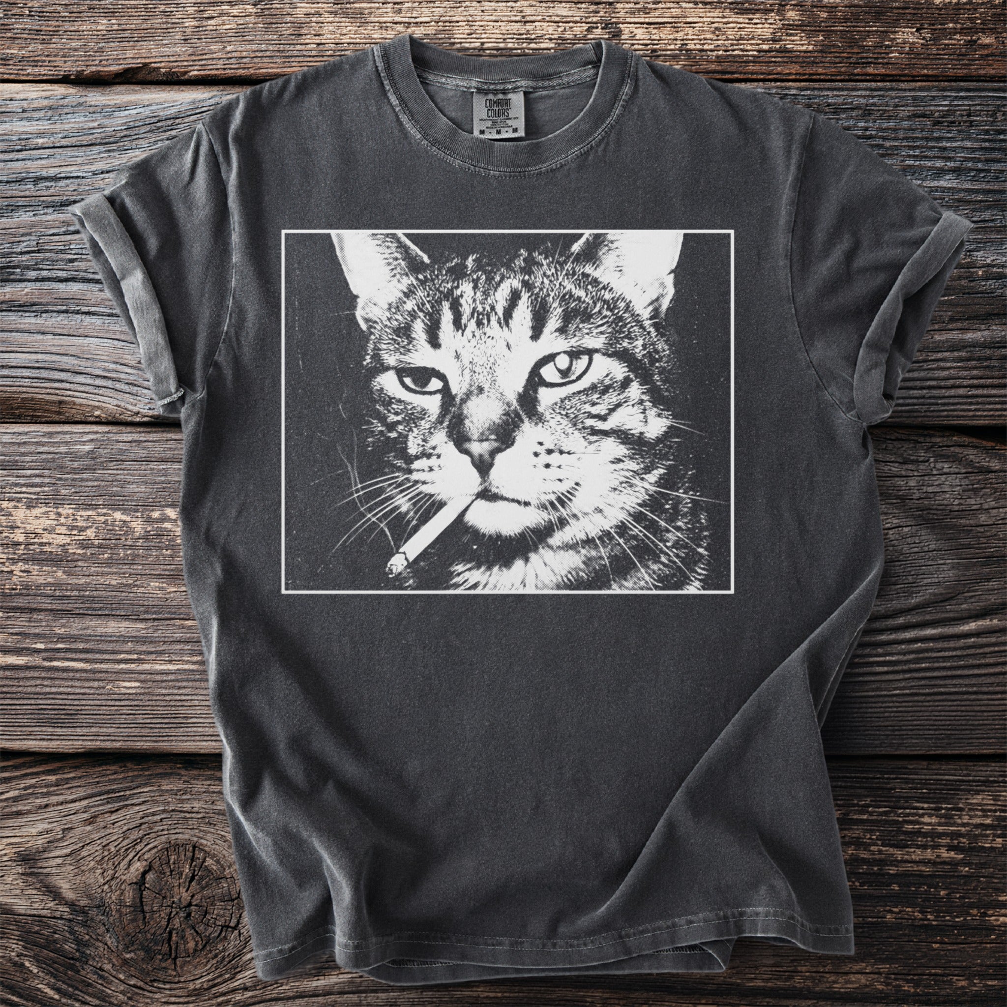 T-shirt with a black and white graphic of a cat smoking a cigarette.