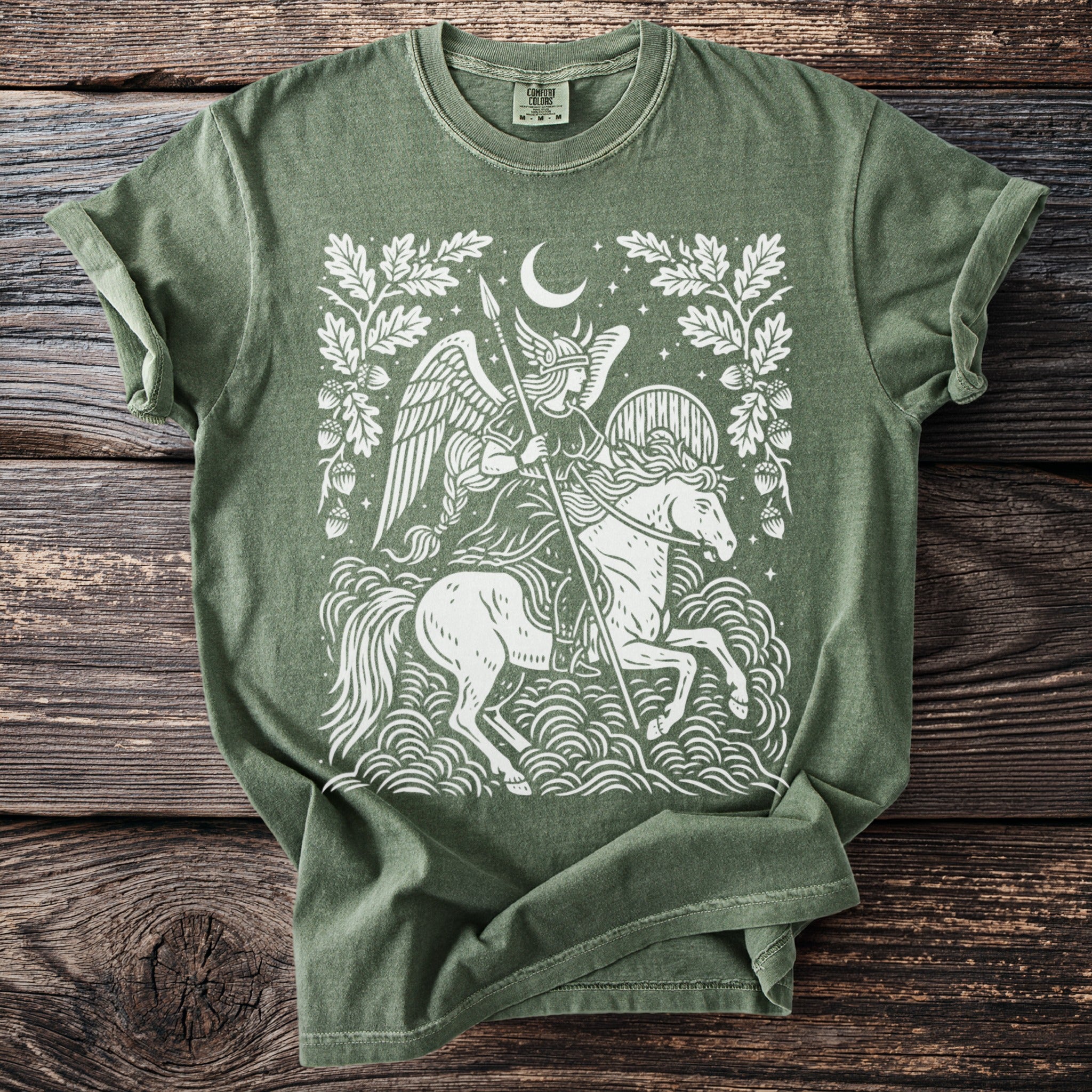 Green t-shirt with white Valkyrie on a horse and moon design.