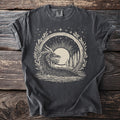 Dark gray t-shirt with a cream circular graphic of a dragon in water with trees and a moon.