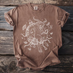 Brown t-shirt featuring a white line-art drawing of Krampus surrounded by chains and bells.