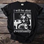 Black t-shirt with wolf character sitting at a table holding a mug and text.