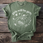 Green t-shirt with white graphic of a spider and prey, text reads "girls will be girls."