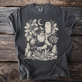 Dark gray t-shirt showing Odin with an owl, oak leaves, moon, and woodland details.