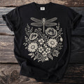 Black t-shirt with a vintage-style cream dragonfly and floral line art design.