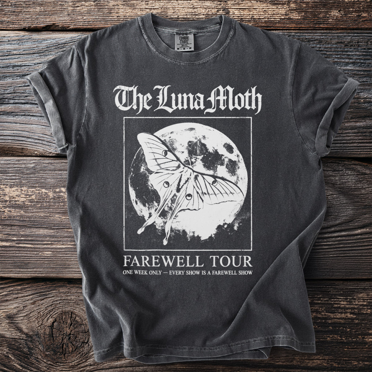 Dark t-shirt with white text "The Luna Moth" and moth on moon design.