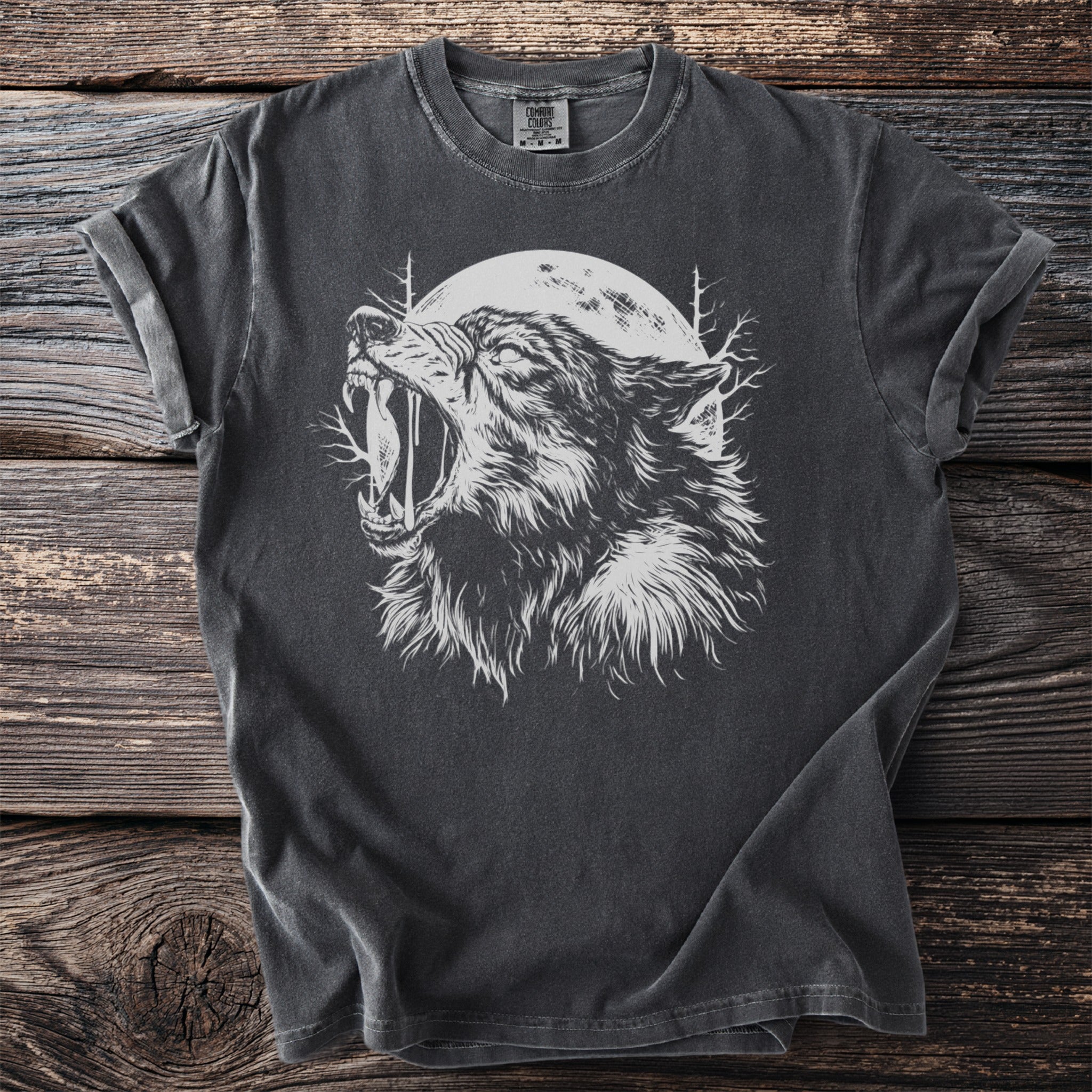 Dark grey t-shirt with a white howling wolf graphic and moon.