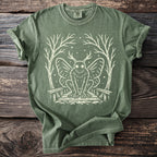 Green t-shirt with white mothman illustration and Comfort Colors tag.