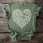 Green t-shirt with white snake heart and rose design.