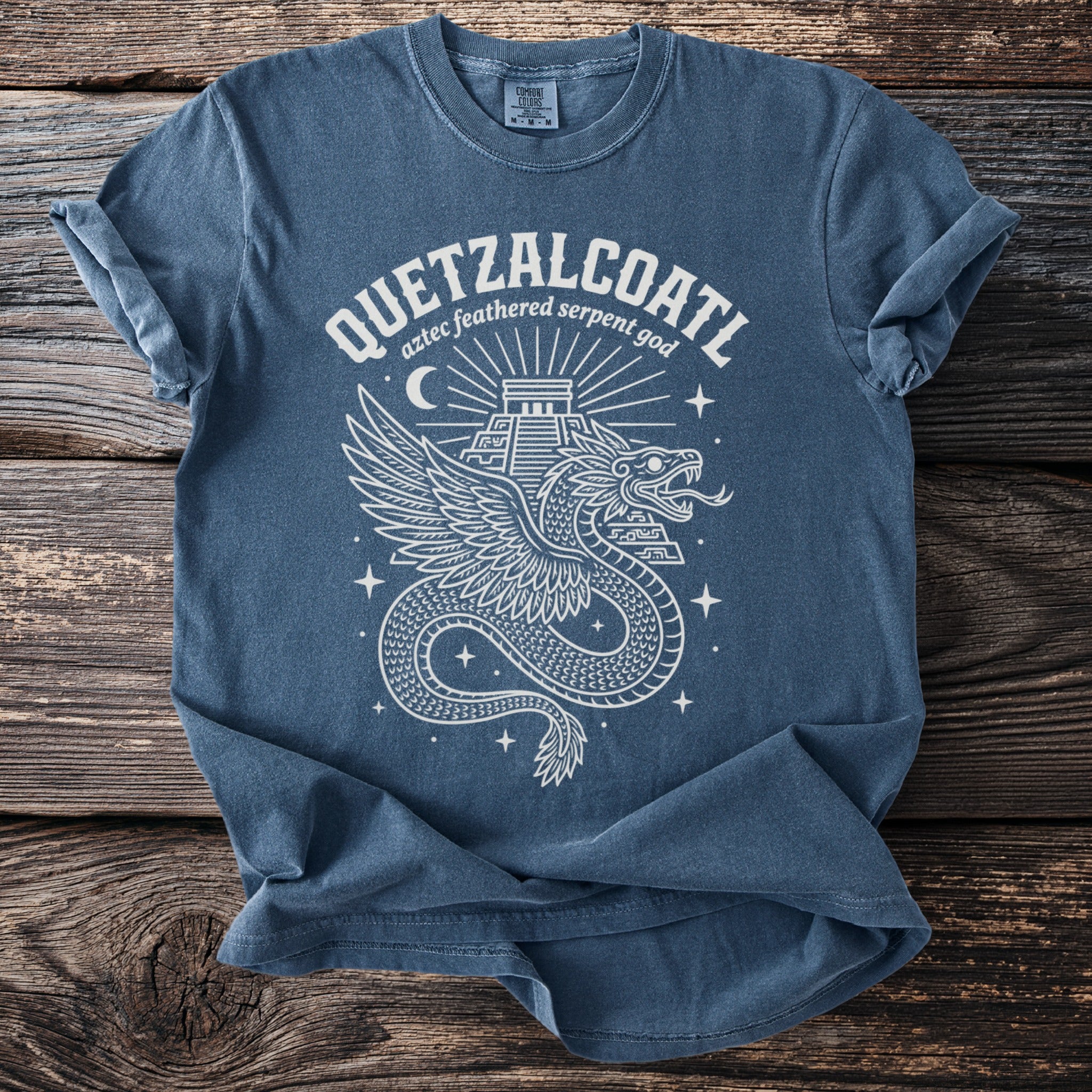 Blue t-shirt with Quetzalcoatl winged serpent god design and text.