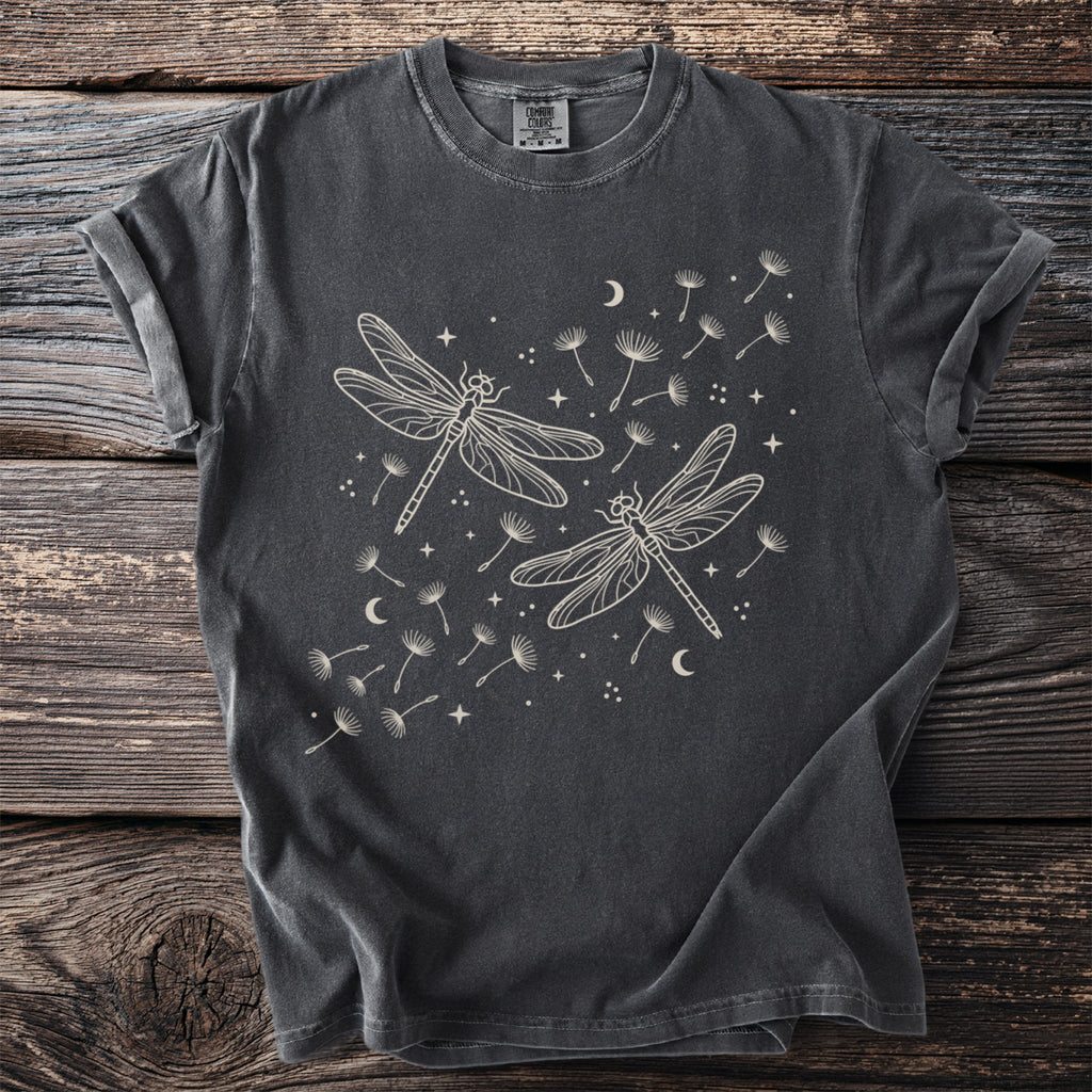 Charcoal t-shirt with a light line drawing of two dragonflies among dandelions.