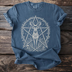 Blue t-shirt with a white deer, crescent moon, pentagram, and botanical elements.