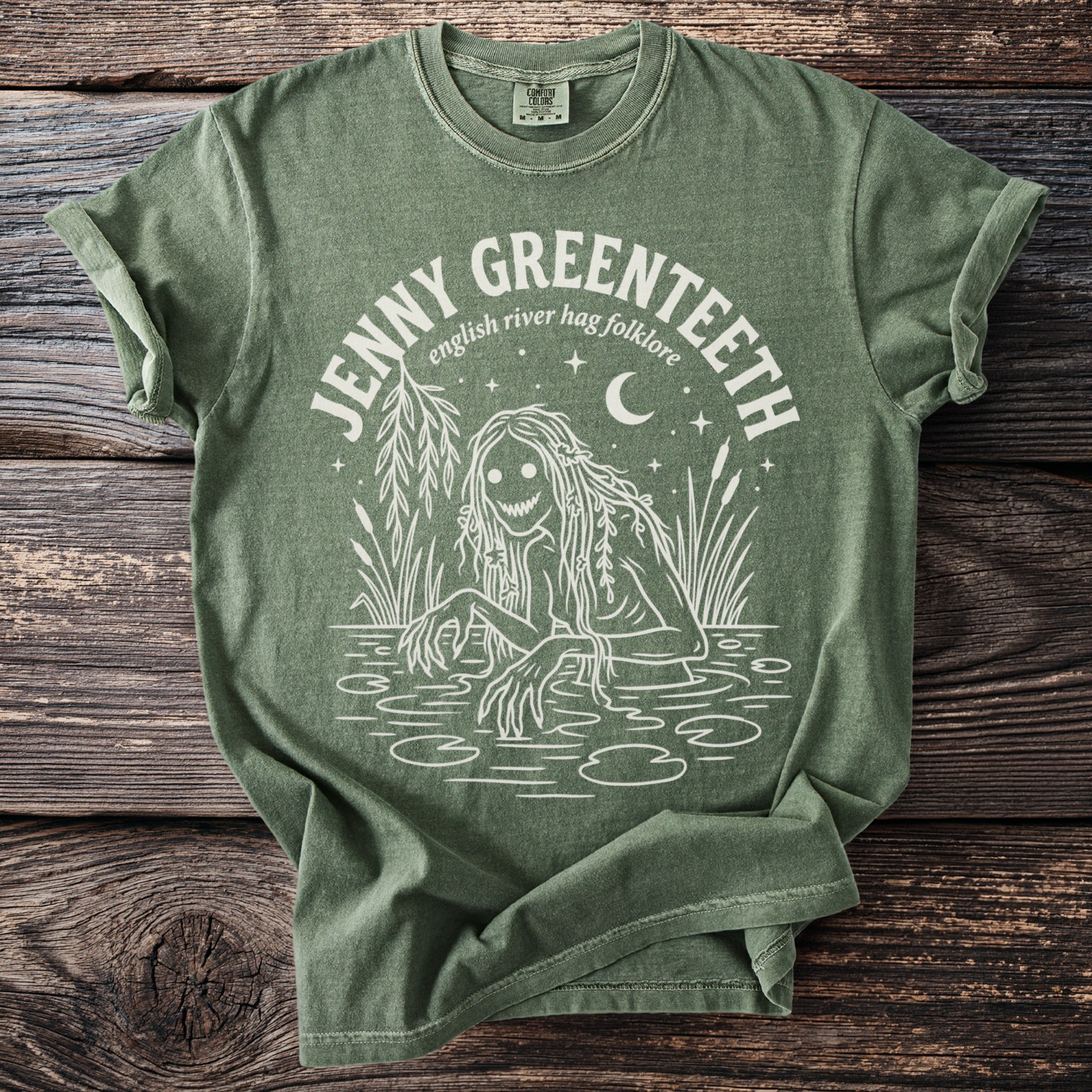 Green t-shirt with white graphic of a water spirit and text "JENNY GREENTEETH english river has folklore".