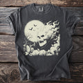 Dark gray t-shirt with a cream graphic of a smoking skull, bats, and a tree against a moon.
