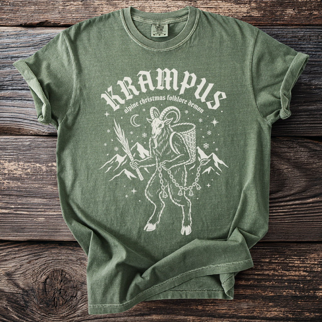 Green t-shirt with Krampus alpine folklore demon graphic and text.