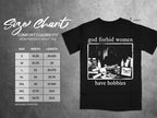 Black t-shirt with "god forbid women have hobbies" graphic and size chart.
