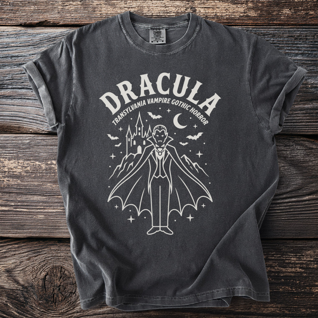 Dark grey t-shirt featuring a white line drawing of Dracula, castle, bats, and moon.