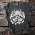 Dark gray t-shirt with a white tentacled creature design.