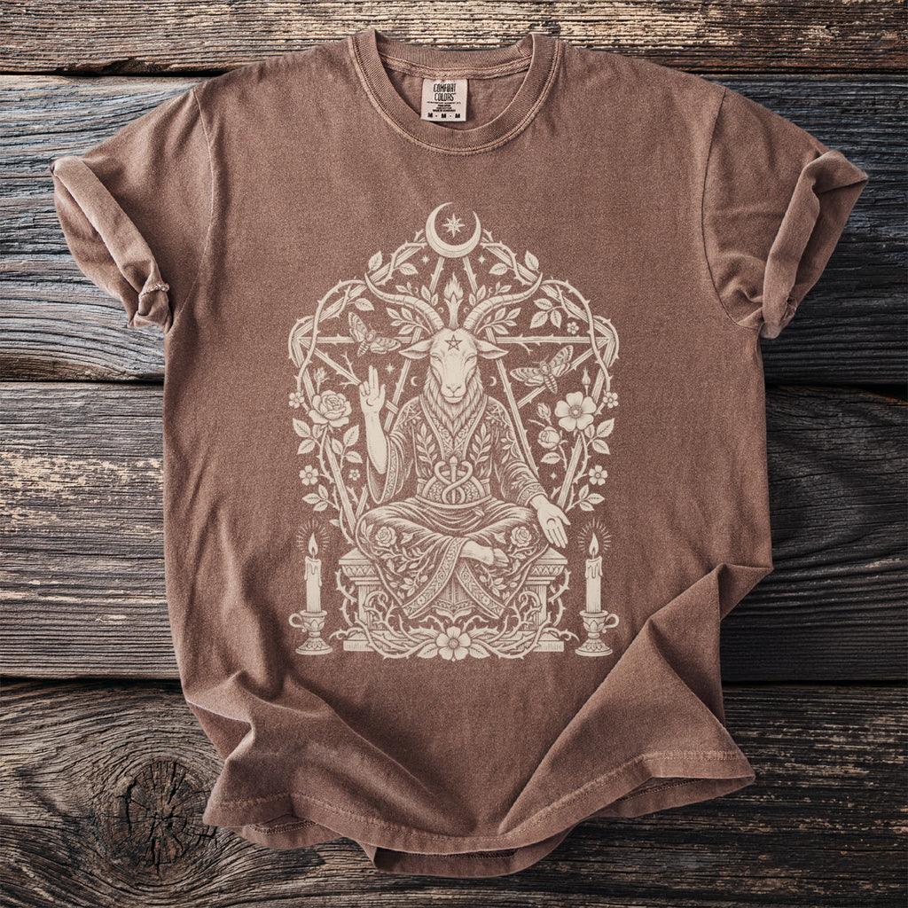 Brown t-shirt with a cream-colored occult graphic of a seated goat-headed figure.