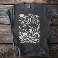 Pepper grey t-shirt with a cream graphic of the six-headed sea monster Scylla above a ship in rough seas.