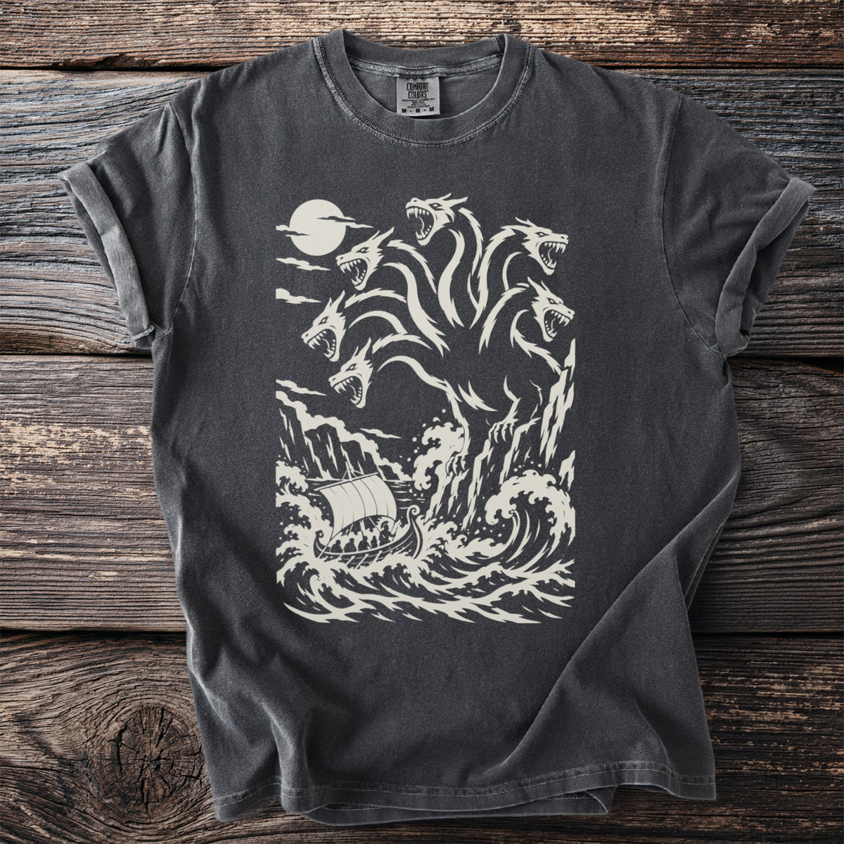 Pepper grey t-shirt with a cream graphic of the six-headed sea monster Scylla above a ship in rough seas.