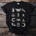 Black t-shirt with a grid of cream-colored insect and nature illustrations.