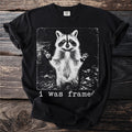 Black t-shirt with a distressed raccoon graphic and "i was framed" text.