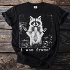 Black t-shirt with a distressed raccoon graphic and "i was framed" text.