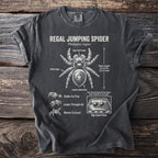 Regal Jumping Spider diagram on a charcoal t-shirt with detailed anatomy and behaviors.