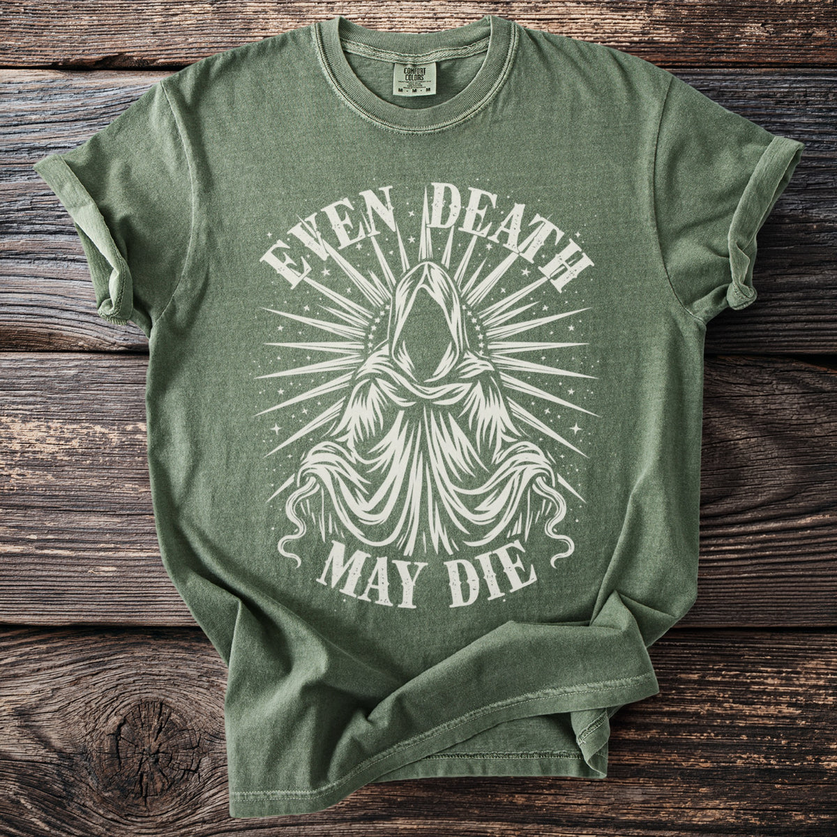 Green t-shirt with white graphic of a hooded figure and text "EVEN DEATH MAY DIE".