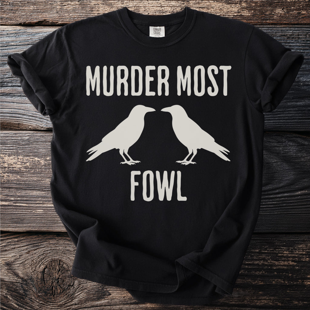 Black t-shirt with "MURDER MOST FOWL" text and two white crow outlines.