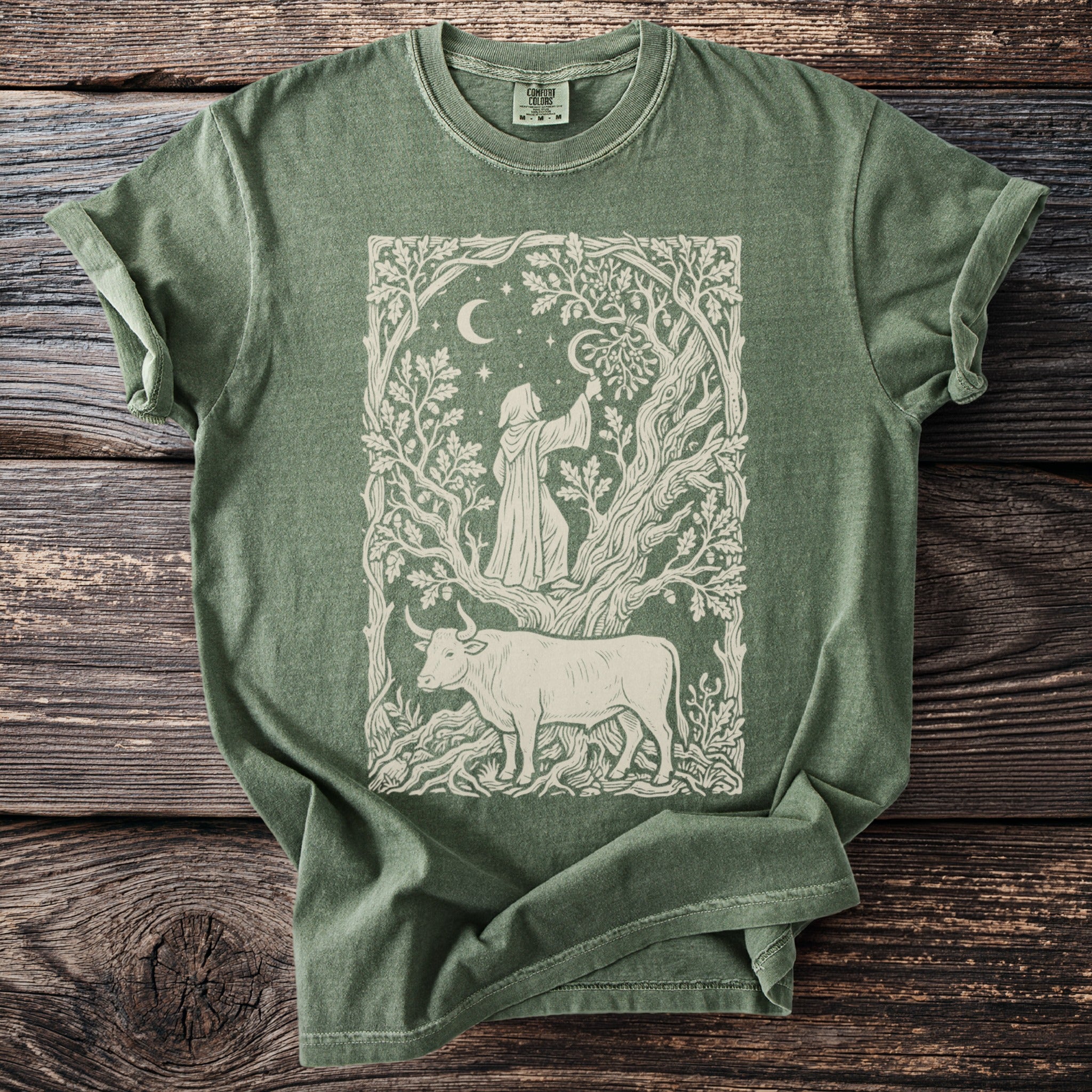 A person in a robe reaches towards the moon within a tree, with a bull below.