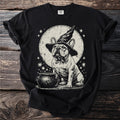 French bulldog wearing a witch hat with a cauldron and moon graphic.