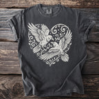 Dark t-shirt with white graphic of two birds in a heart with floral and star accents.