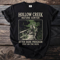 Black t-shirt with "Hollow Creek Nature Center" and wildlife on a boardwalk.