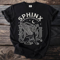 Black t-shirt with white graphic of a winged sphinx and text "SPHINX GREEK RIDDLE GUARDIAN MYTH".