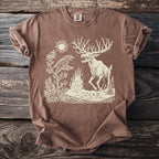 Brown t-shirt with a stylized linocut art of a raven, moose, sun, and fire.