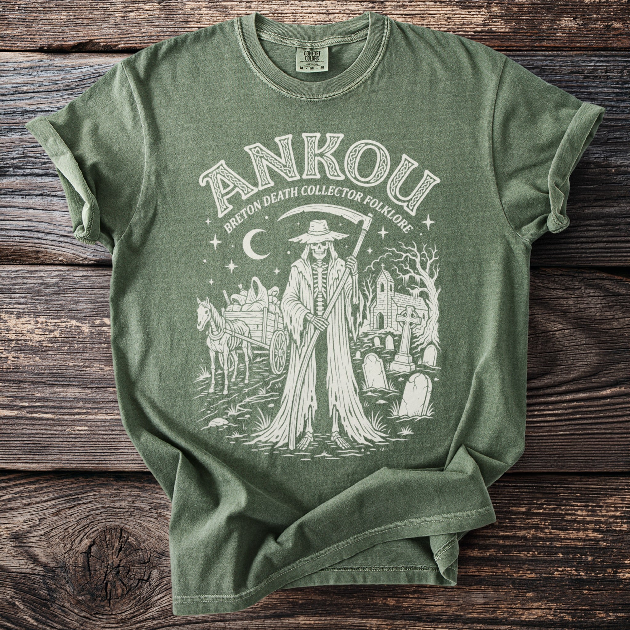 Green t-shirt with "Ankou Breton Death Collector Folklore" design featuring a Grim Reaper, cart, and graveyard.