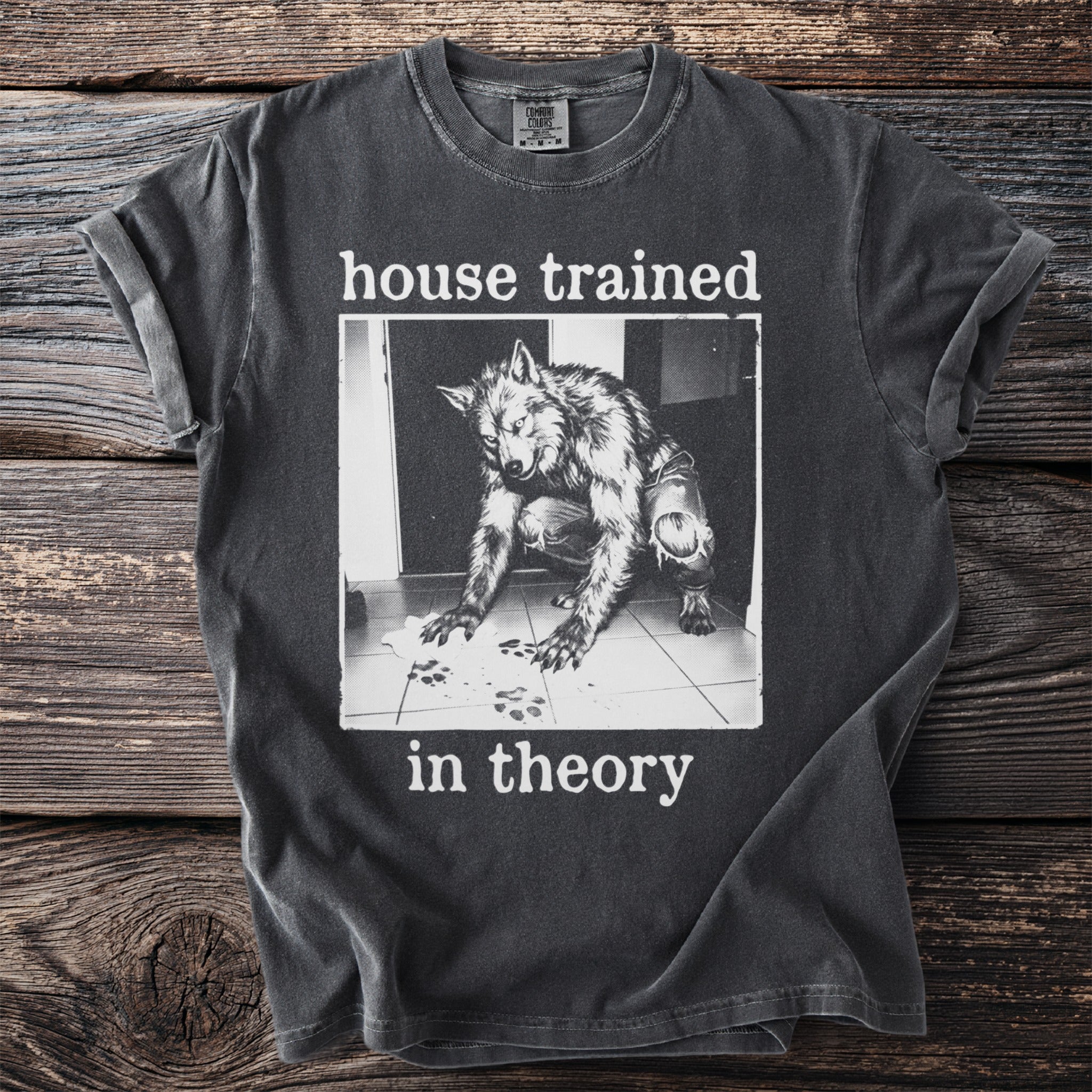 Dark grey t-shirt with werewolf graphic and "house trained in theory" text.