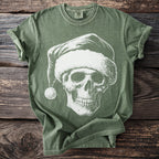 Green t-shirt with a white skull wearing a Santa hat graphic.