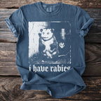 Blue t-shirt with a distressed graphic of an opossum and the text "i have rabies".