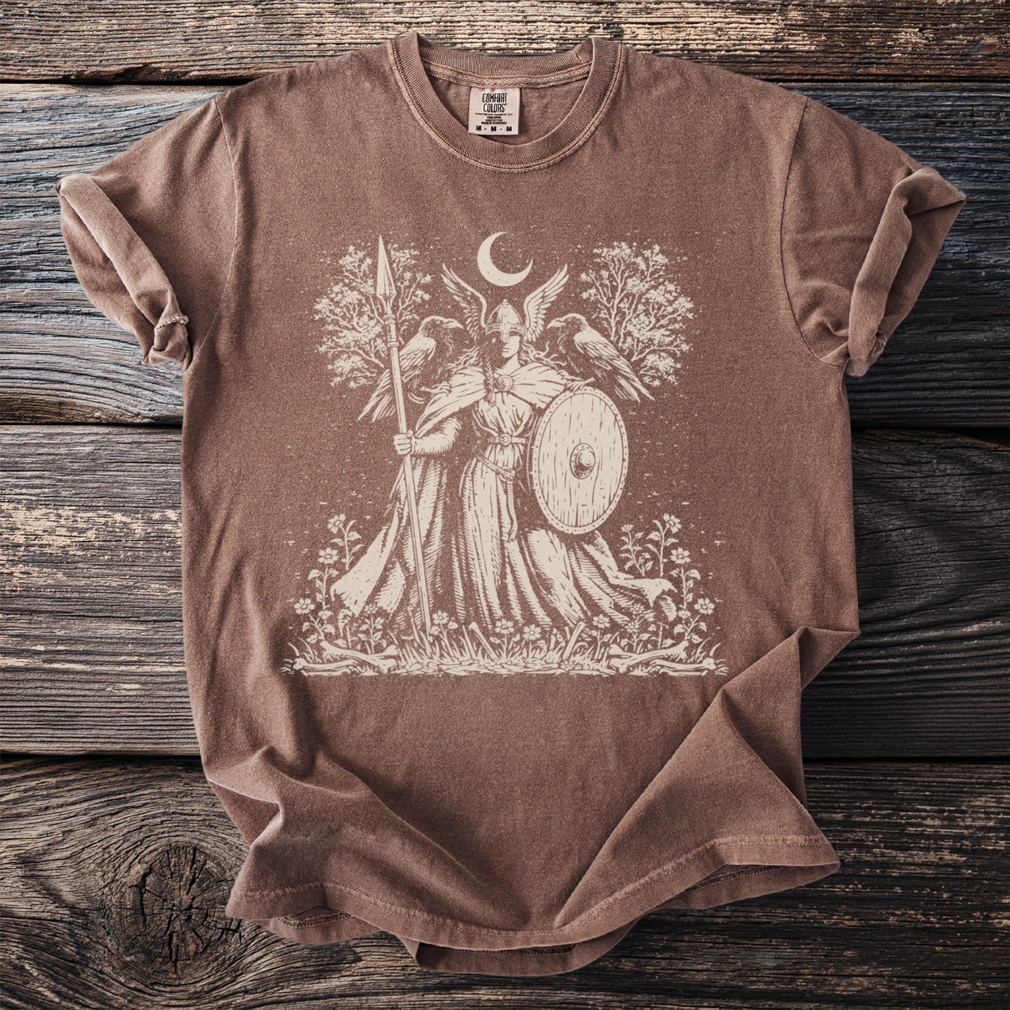 Brown t-shirt with a cream-colored graphic of a winged warrior holding a spear and shield.
