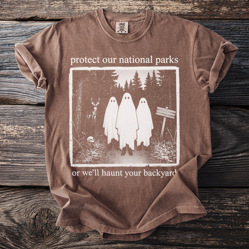 Brown t-shirt with "protect our national parks" text and ghost graphic.