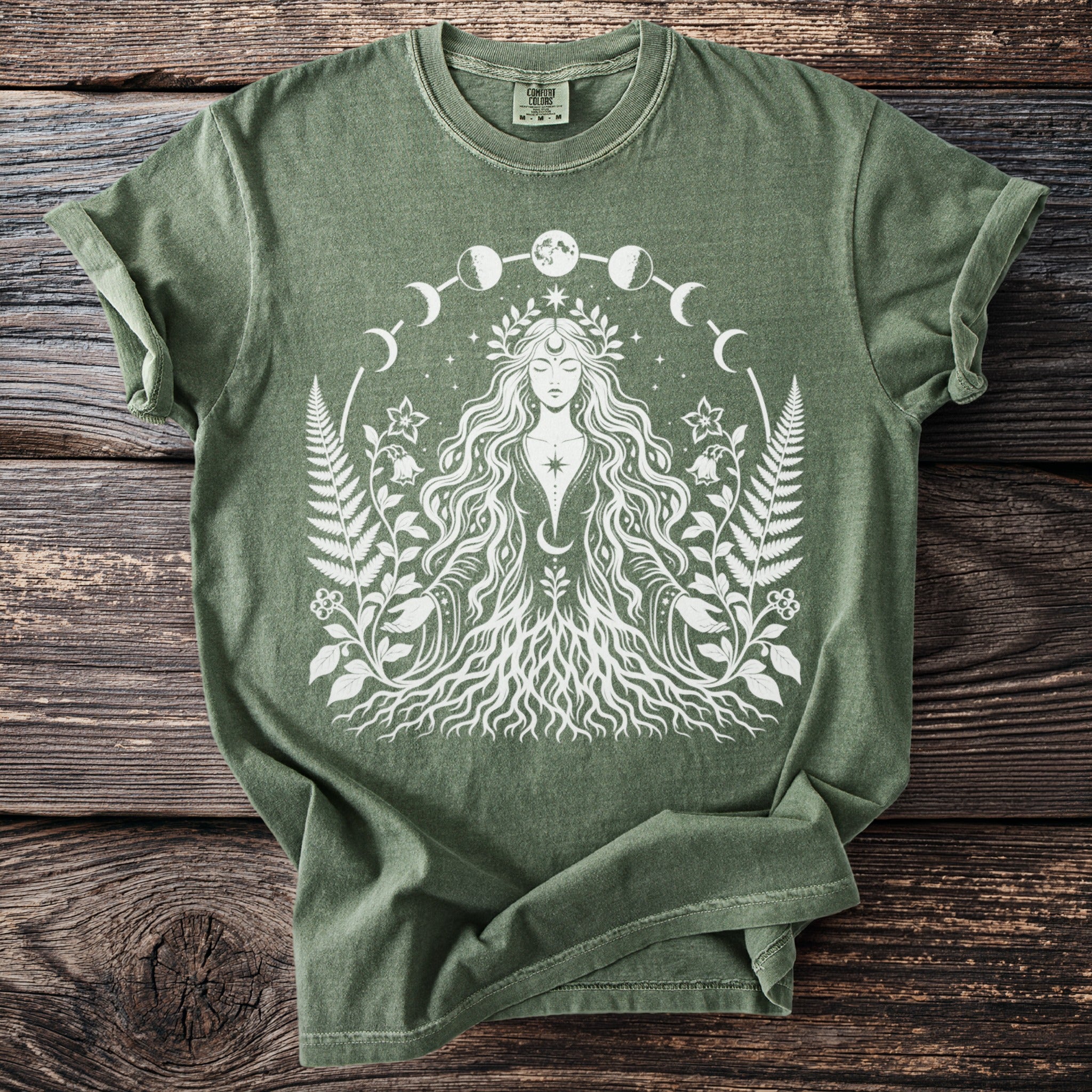 Green t-shirt with white graphic of a woman with long hair and floral elements.
