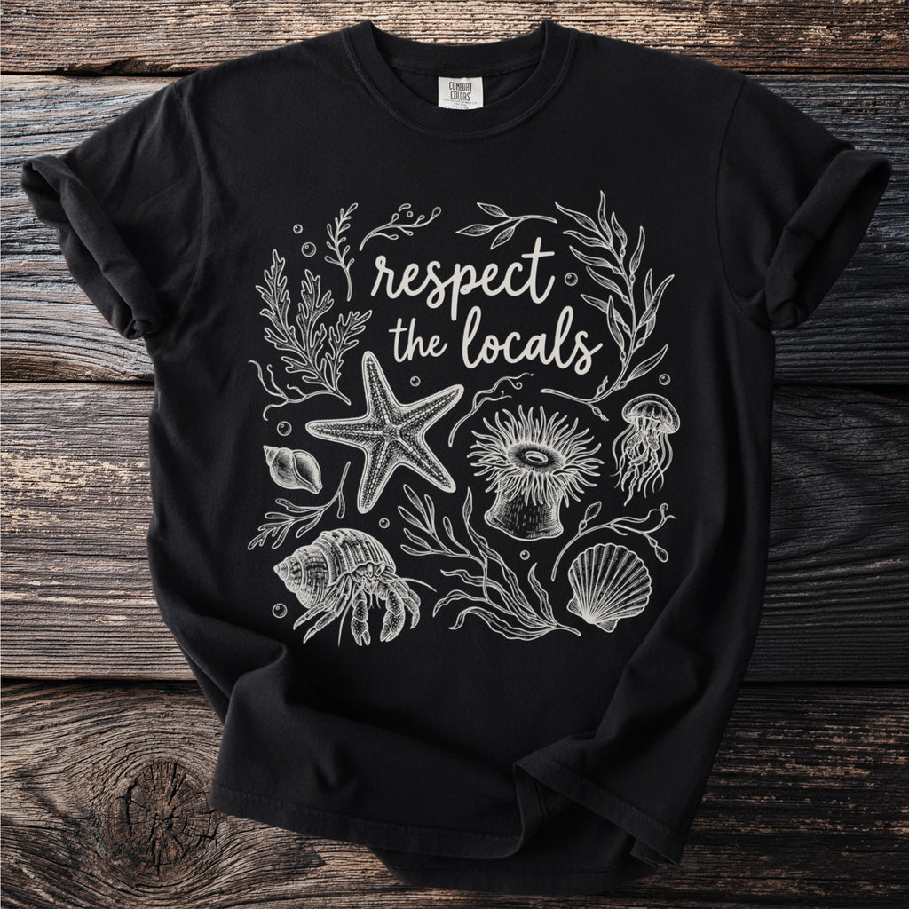 Black t-shirt with "respect the locals" encircled by sea creatures and plants.