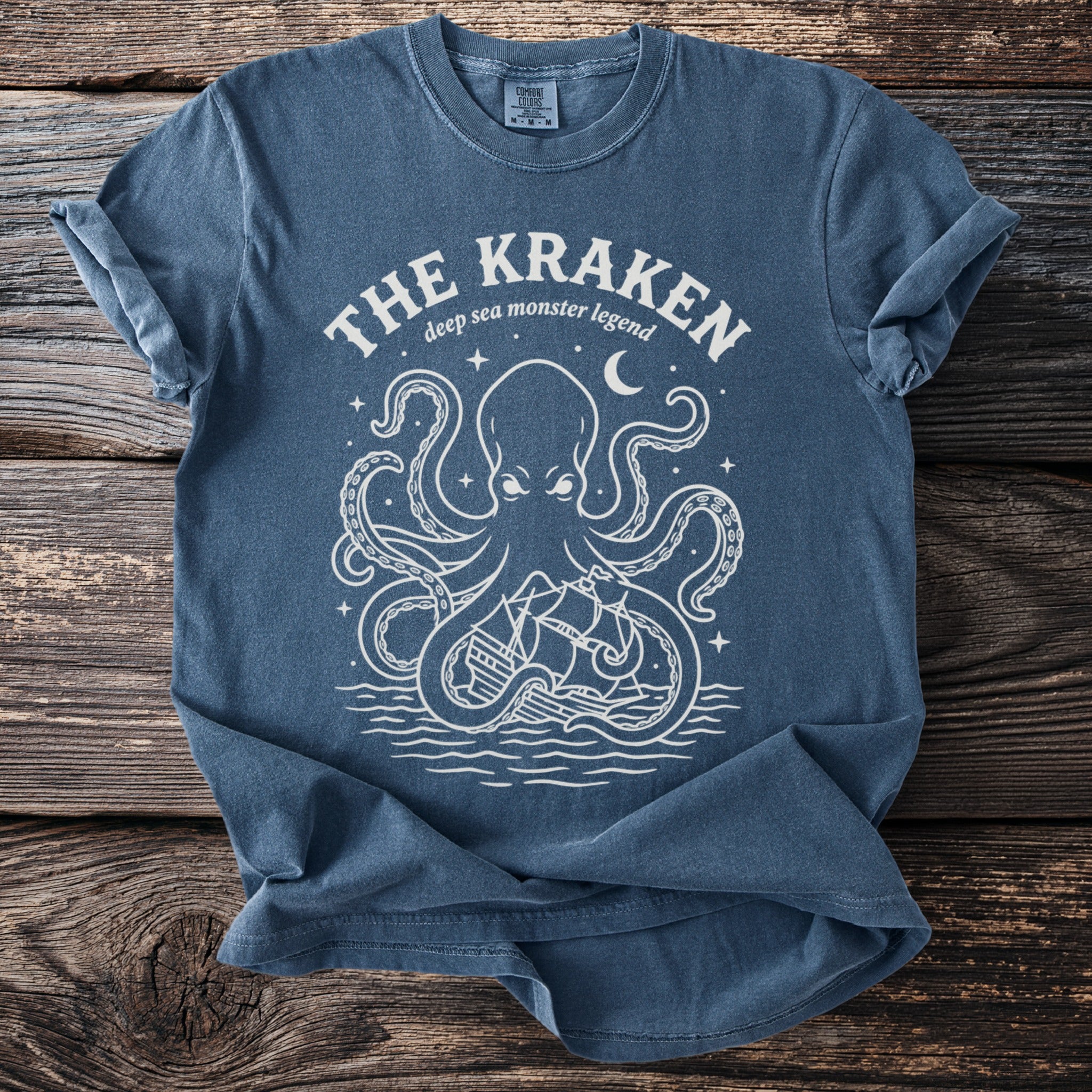 The Kraken deep sea monster legend design on a blue t-shirt.