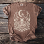 Brown t-shirt with a deer skull, raven, moon, candles, and nature design.