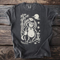 Tanuki with sake bag and bamboo, under a full moon and Japanese lantern.