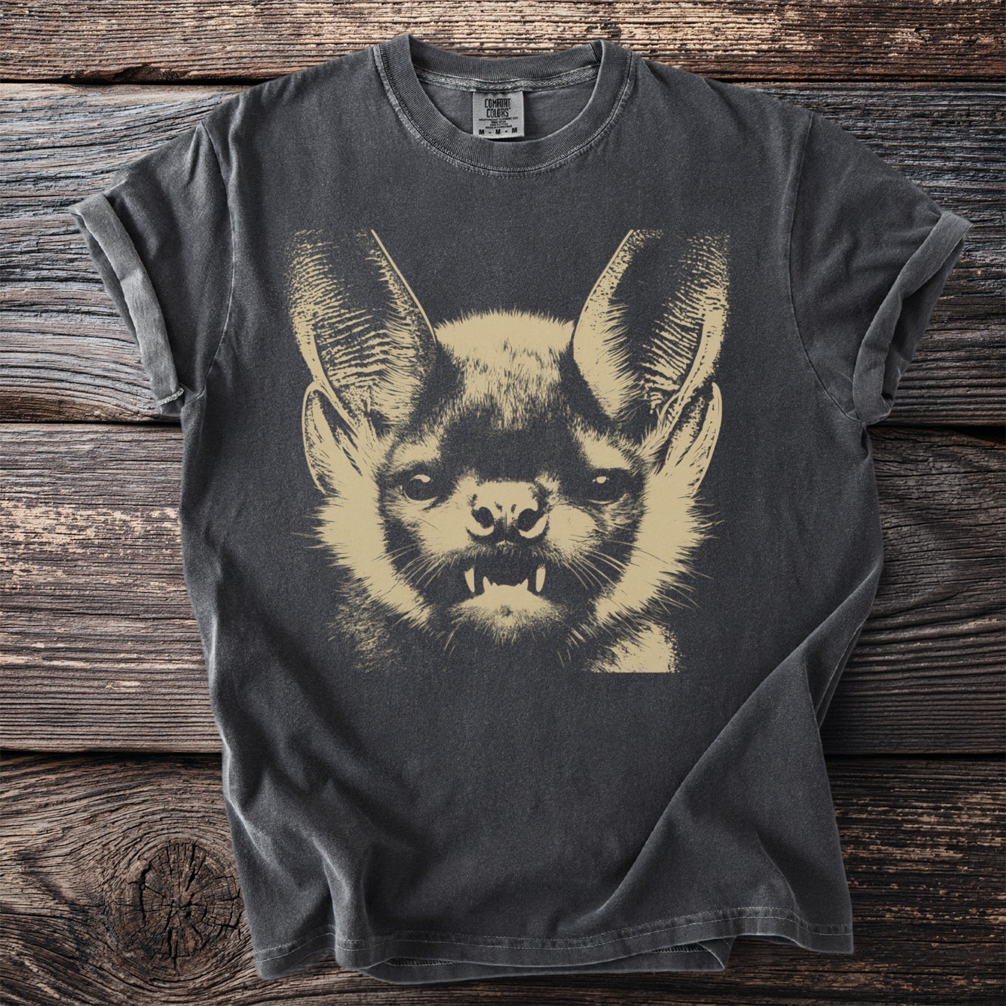Gray t-shirt with a graphic print of a fierce bat's face.