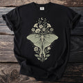 Black t-shirt with a mint green luna moth and floral design.
