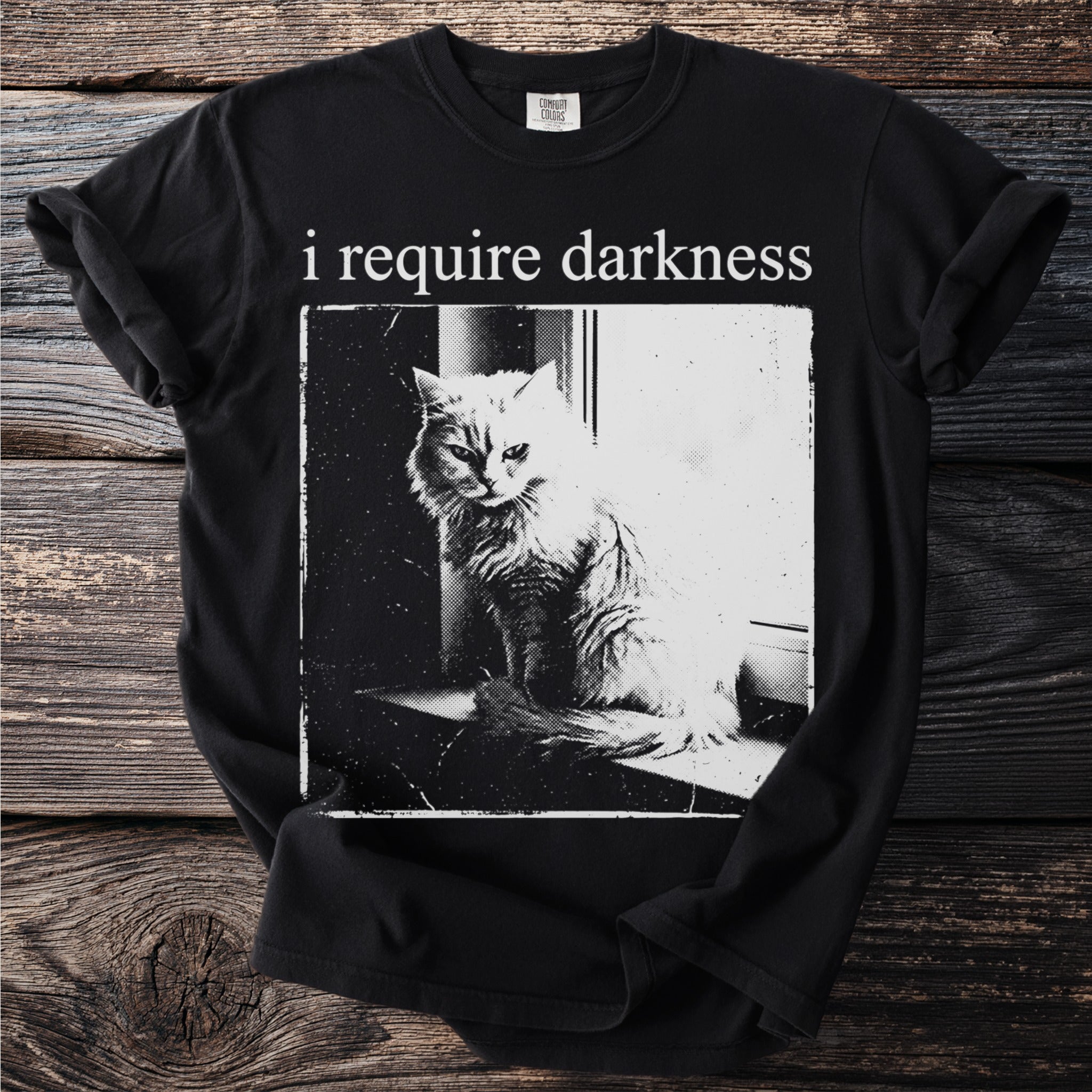 Black t-shirt with "i require darkness" and a cat illustration.